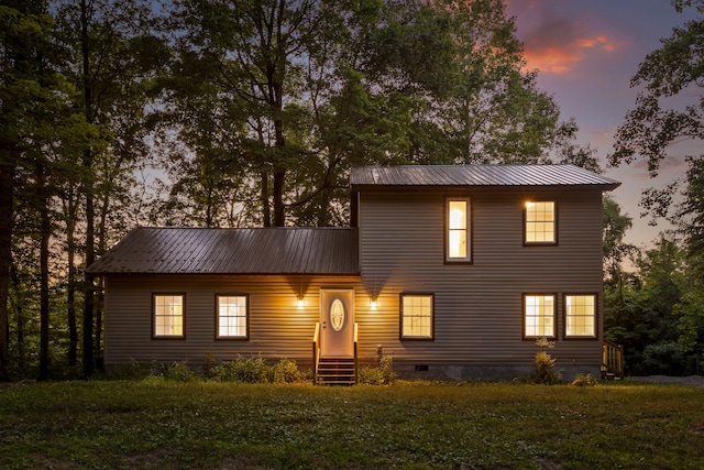 view of front of property with a yard