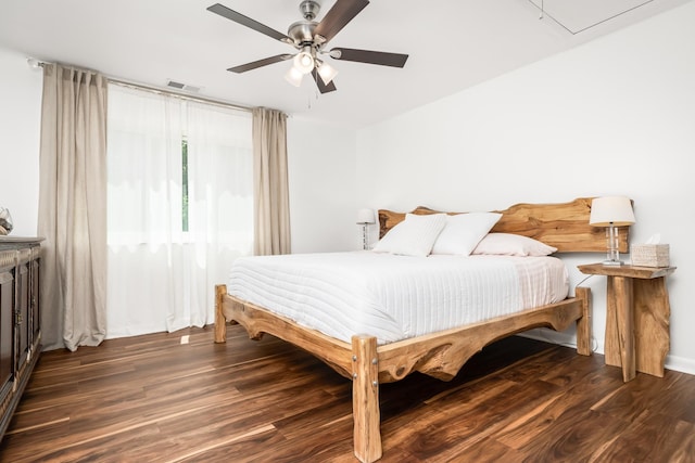 bedroom featuring ceiling fan and dark wood-type flooring