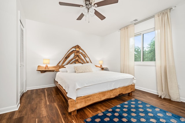 bedroom with ceiling fan and dark wood-type flooring