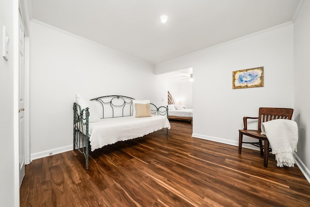 bedroom featuring dark hardwood / wood-style flooring and ornamental molding