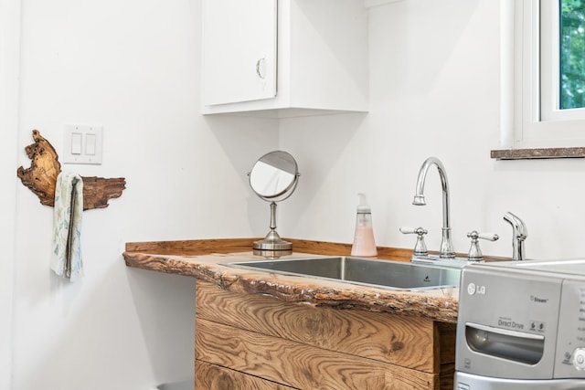 kitchen with white cabinetry and sink