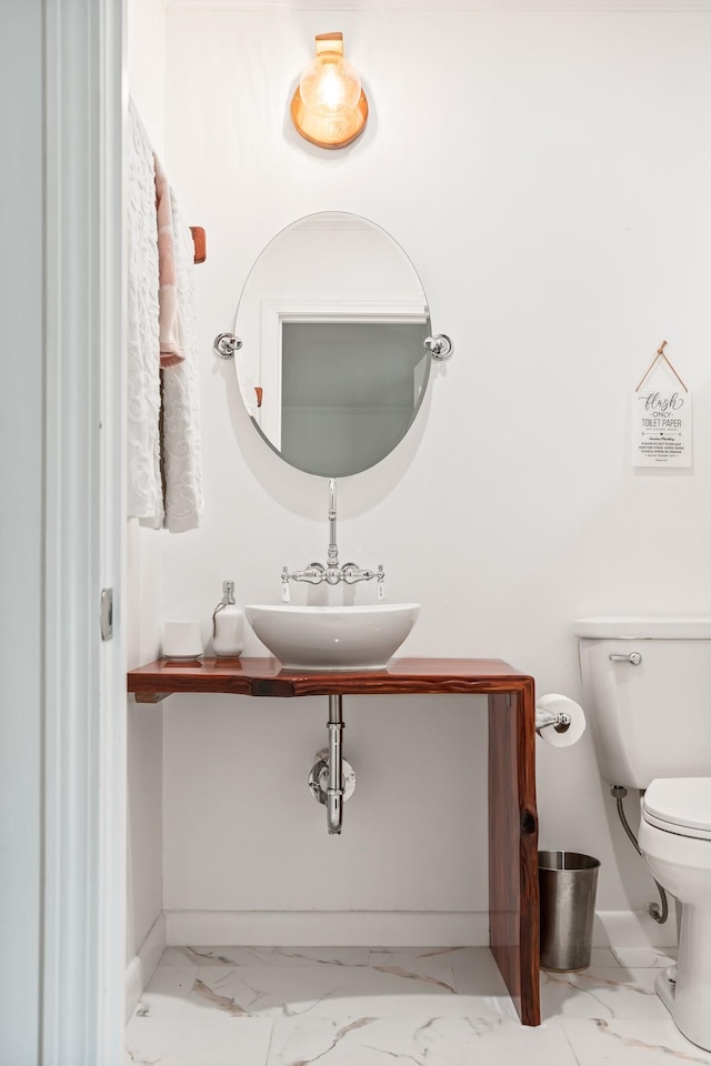 bathroom with sink and toilet