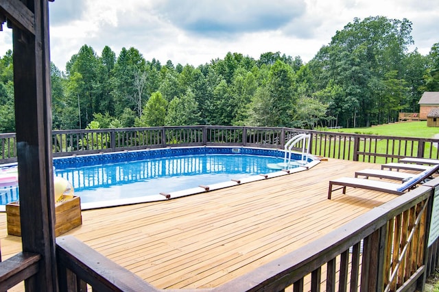 view of pool with a wooden deck