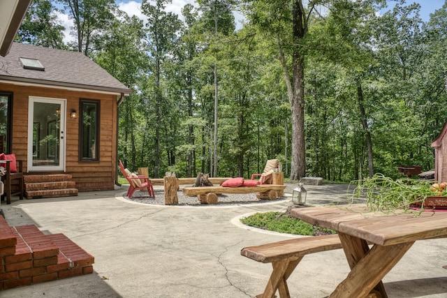 view of patio with a fire pit