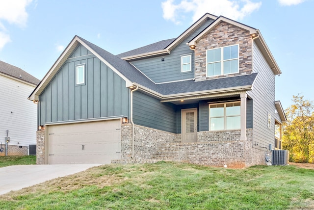 craftsman house with a front yard, a garage, and central air condition unit