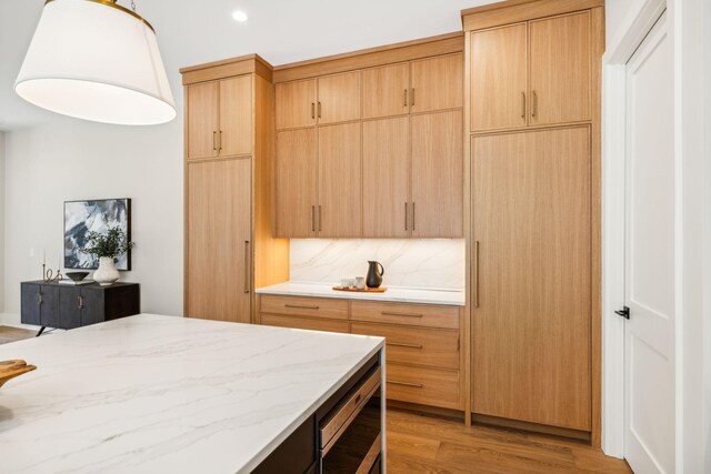 interior space featuring a closet, light hardwood / wood-style flooring, and wine cooler