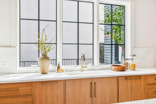 interior space featuring vanity and tasteful backsplash