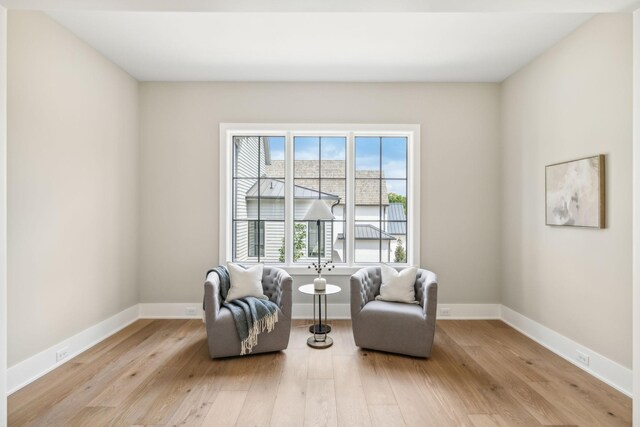 sitting room with light hardwood / wood-style floors