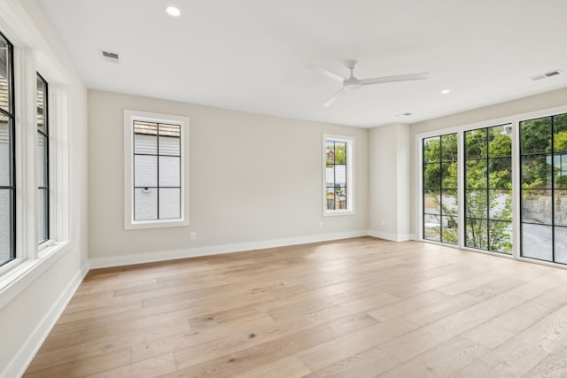 unfurnished room featuring light hardwood / wood-style floors and ceiling fan