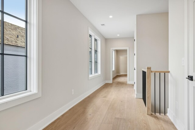 hall with light wood-type flooring