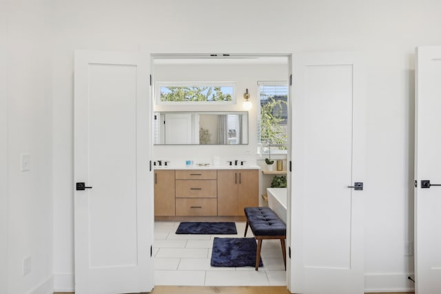 bathroom featuring tile patterned flooring and vanity