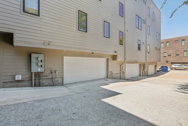 view of property exterior with a garage