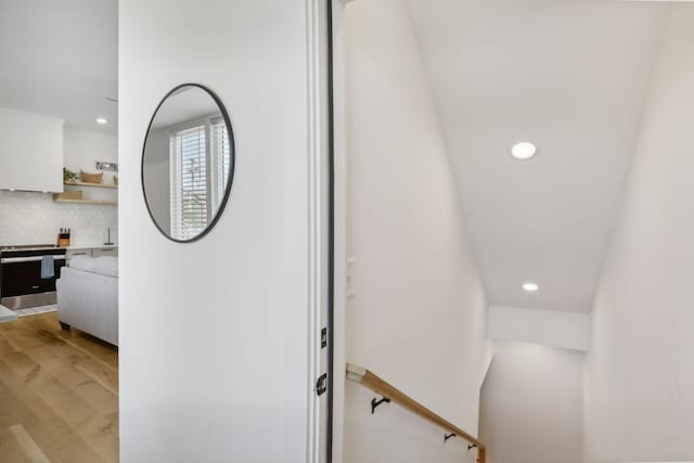 staircase with wood-type flooring