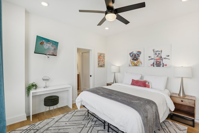 bedroom featuring ceiling fan and light wood-type flooring