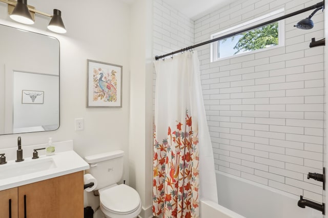 full bathroom with shower / bathtub combination with curtain, vanity, and toilet