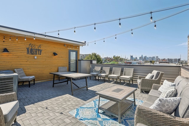 view of patio featuring cooling unit and outdoor lounge area