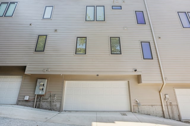 view of property exterior featuring a garage