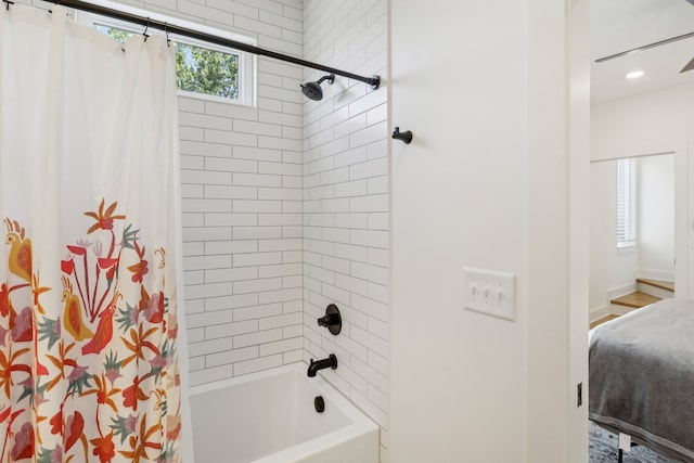 bathroom with shower / bathtub combination with curtain