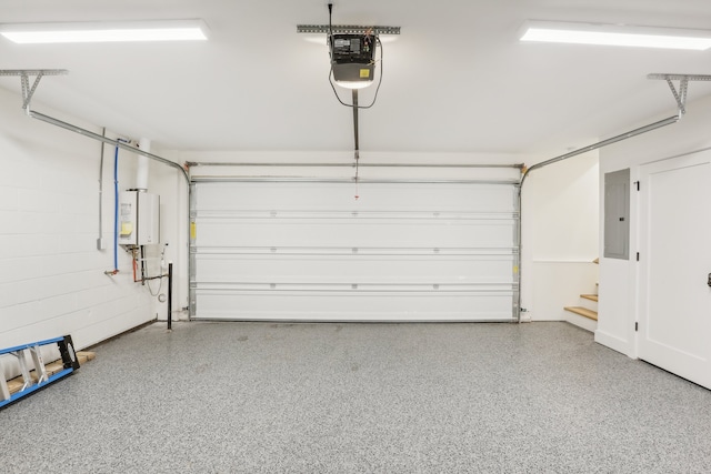 garage featuring a garage door opener, electric panel, and water heater