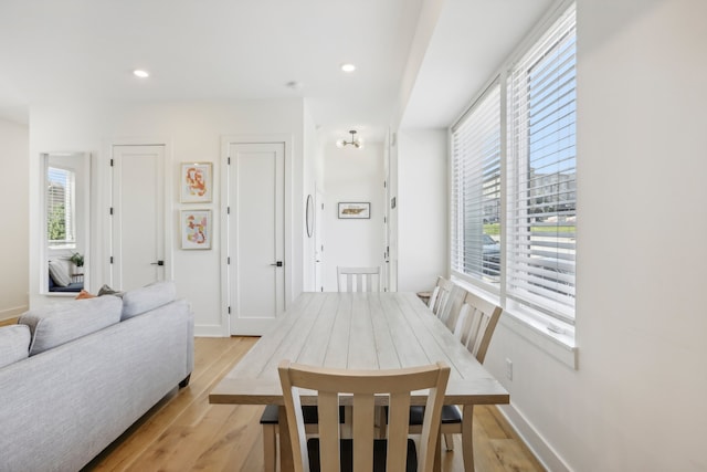 dining area with light hardwood / wood-style floors