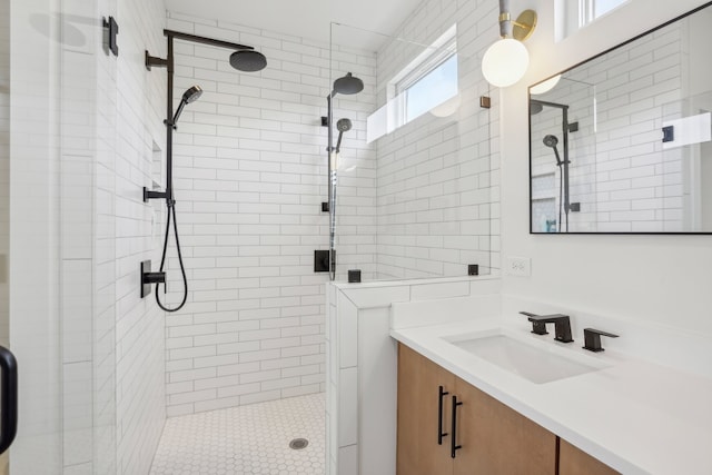 bathroom with vanity and a shower with shower door