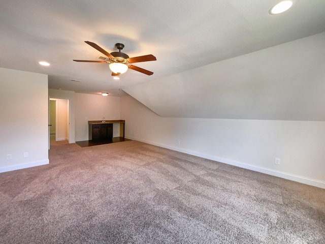 bonus room with carpet, ceiling fan, and lofted ceiling