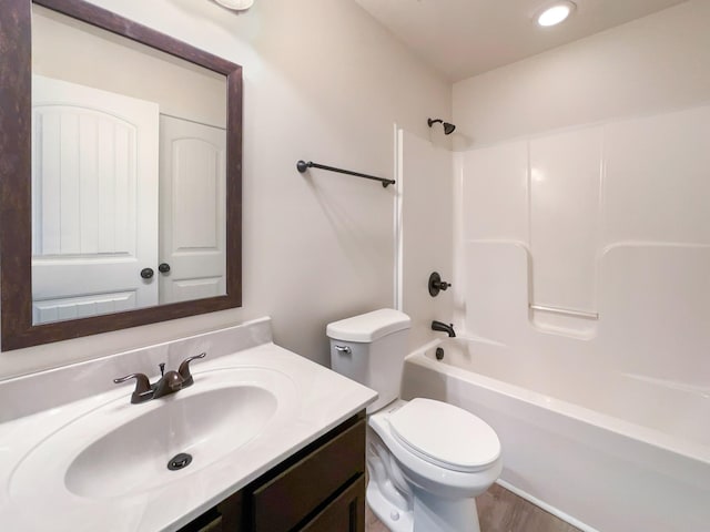 full bathroom with toilet, vanity, and bathing tub / shower combination