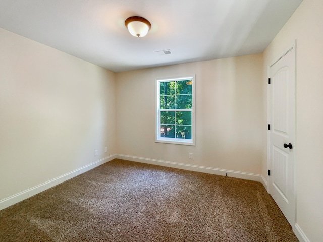 spare room with carpet floors