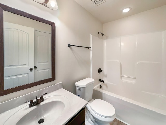 full bathroom featuring vanity, toilet, and bathtub / shower combination