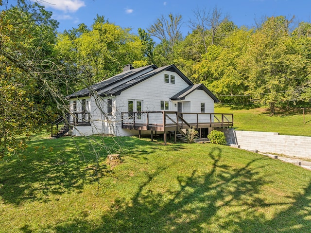 exterior space with a lawn and a deck