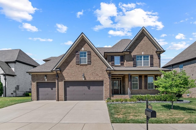 view of front of home with a garage and a front yard