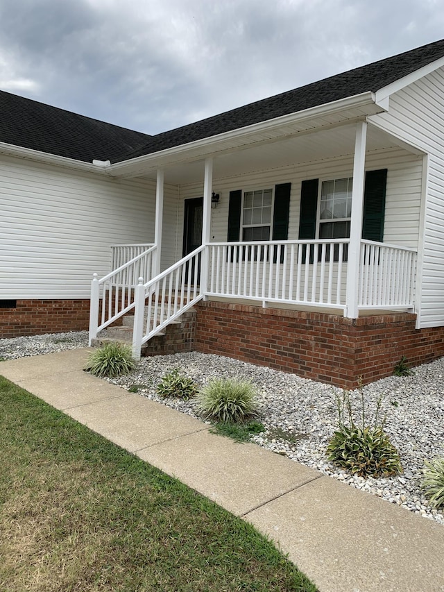 entrance to property with covered porch