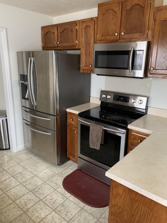 kitchen with appliances with stainless steel finishes