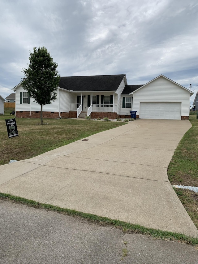 single story home featuring a front lawn, a garage, and a porch