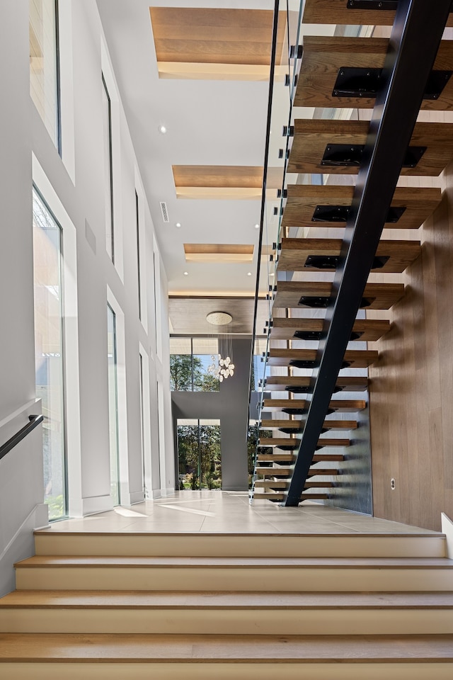 stairway with a towering ceiling