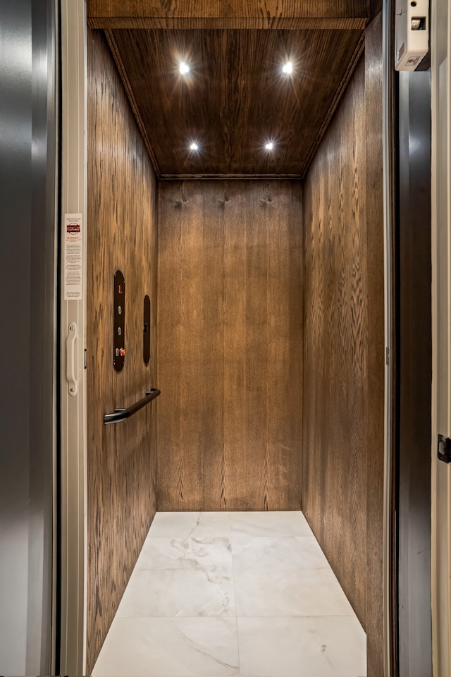 interior details with elevator and wooden walls