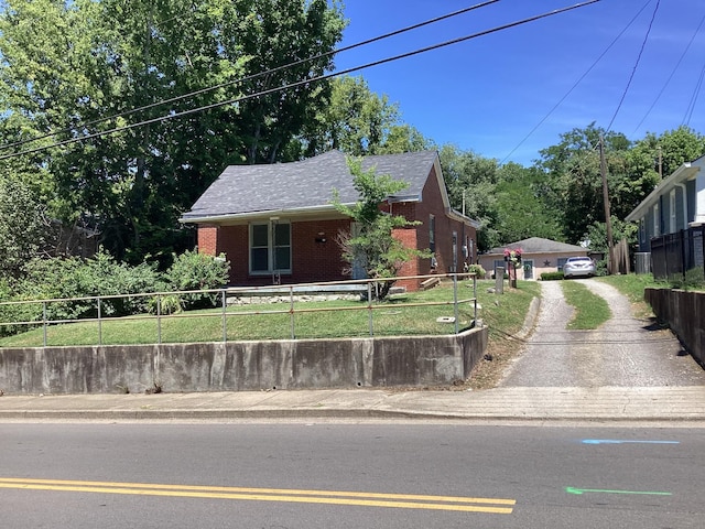 406 Natchez St, Franklin, TN 37064 - view of front of house featuring brick siding and roof with shingles