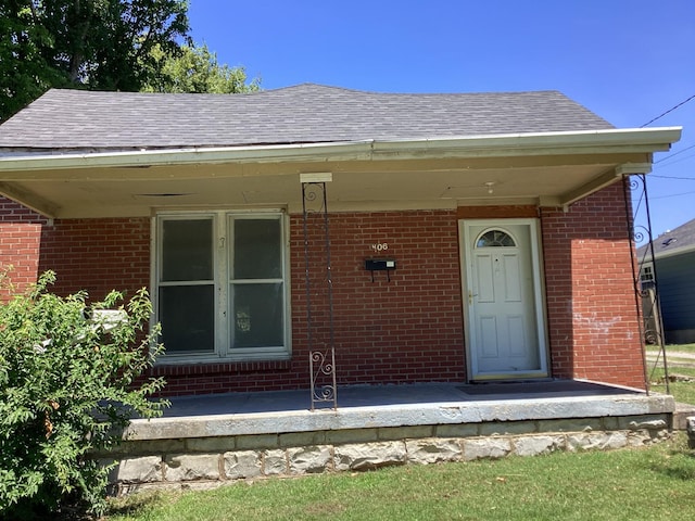 406 Natchez St, Franklin, TN 37064 - view of exterior entry with brick siding and roof with shingles