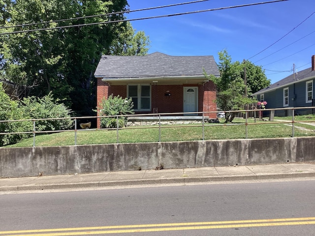 406 Natchez St, Franklin, TN 37064 - view of front of home featuring brick siding, a fenced front yard, and roof with shingles
