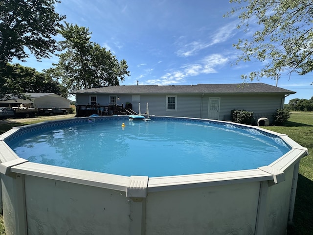 view of swimming pool with a wooden deck