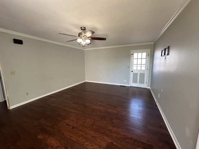 empty room featuring ceiling fan, dark hardwood / wood-style flooring, and ornamental molding