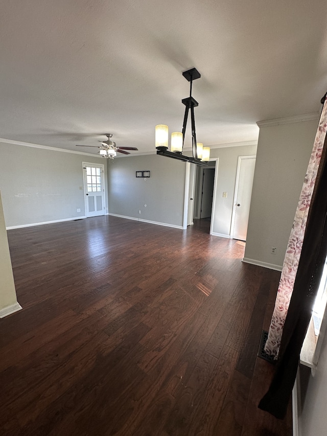 unfurnished living room with dark hardwood / wood-style floors, ceiling fan, and ornamental molding