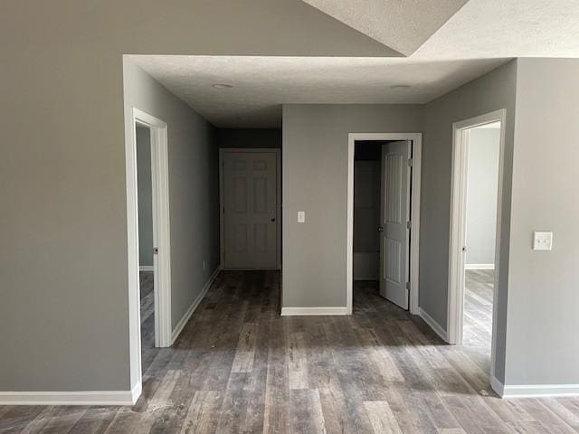 interior space with wood finished floors and baseboards