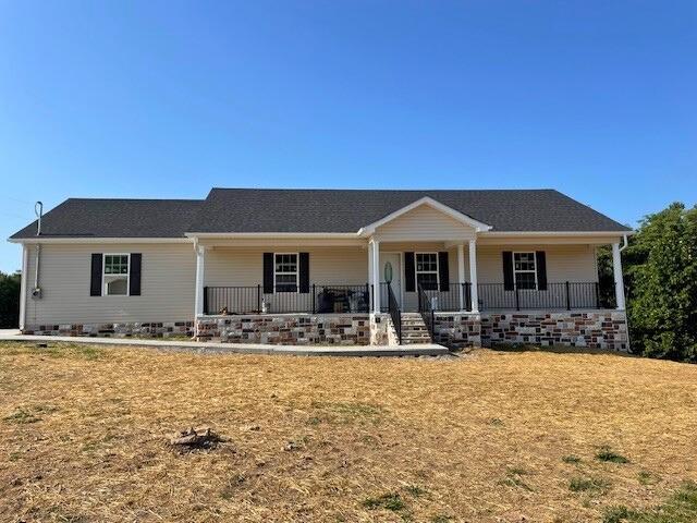 ranch-style home featuring covered porch