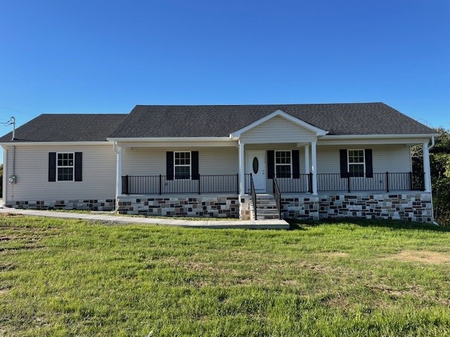 ranch-style house featuring a porch and a front lawn