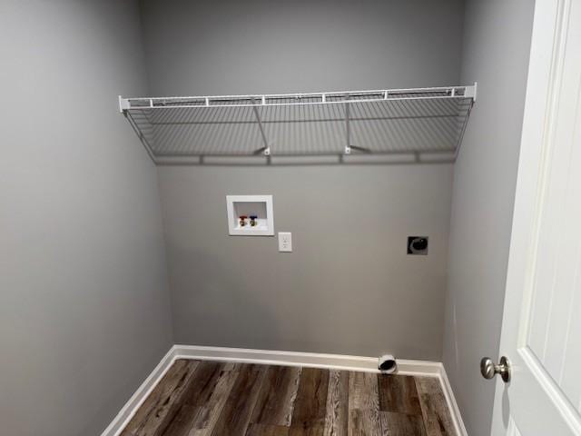 laundry room with laundry area, hookup for an electric dryer, washer hookup, dark wood-style flooring, and baseboards