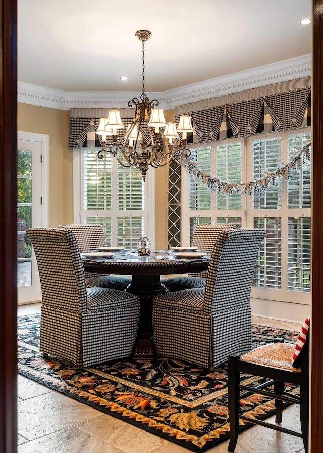 dining area featuring a notable chandelier and crown molding