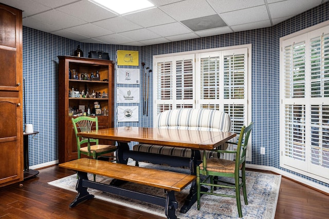 dining area with dark hardwood / wood-style flooring