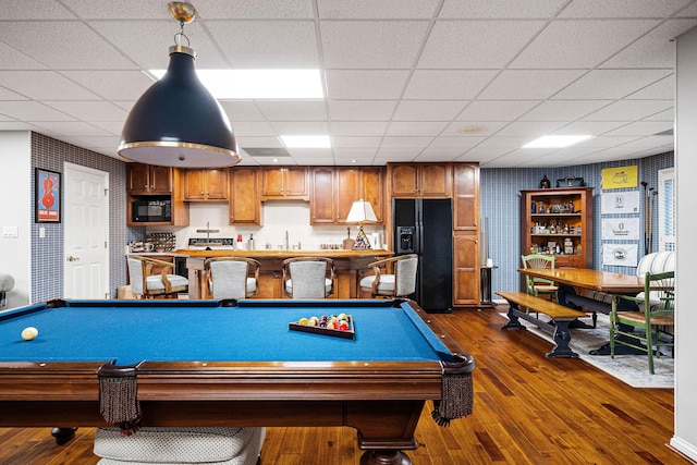 game room with sink, a drop ceiling, dark wood-type flooring, and pool table