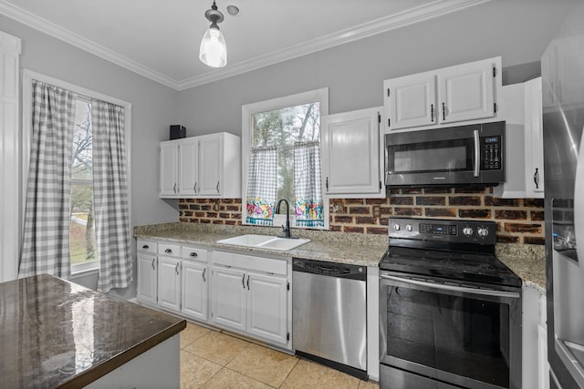 kitchen featuring backsplash, sink, appliances with stainless steel finishes, and white cabinetry